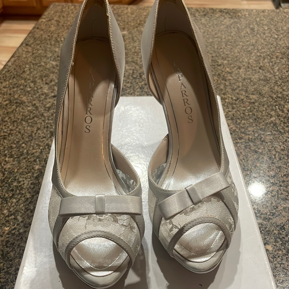 Caparros peep toe high heel with silver lace, never worn